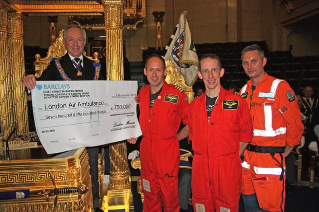 The Freemasons giving a cheque to the London Air Ambulance